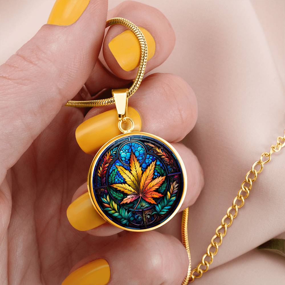 Gold Cannabis Necklace in a Woman's Hand