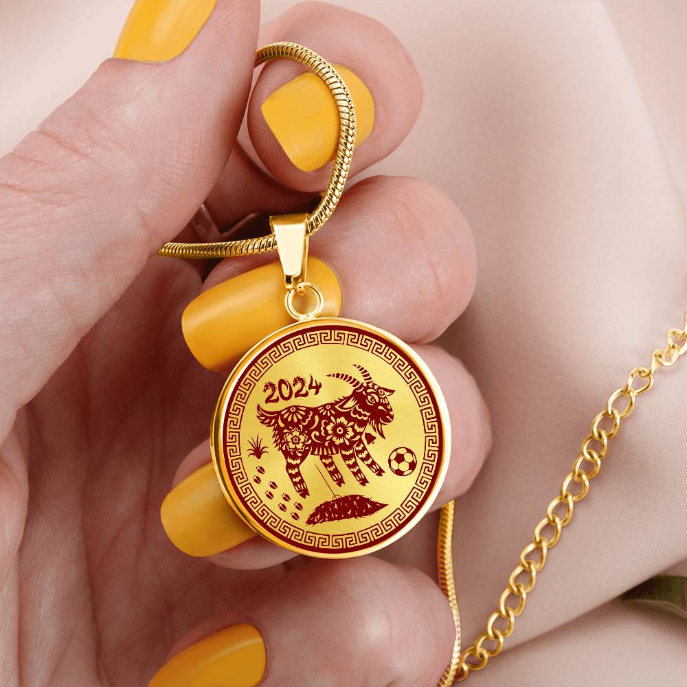 Gold Ram Necklace in a woman's hand