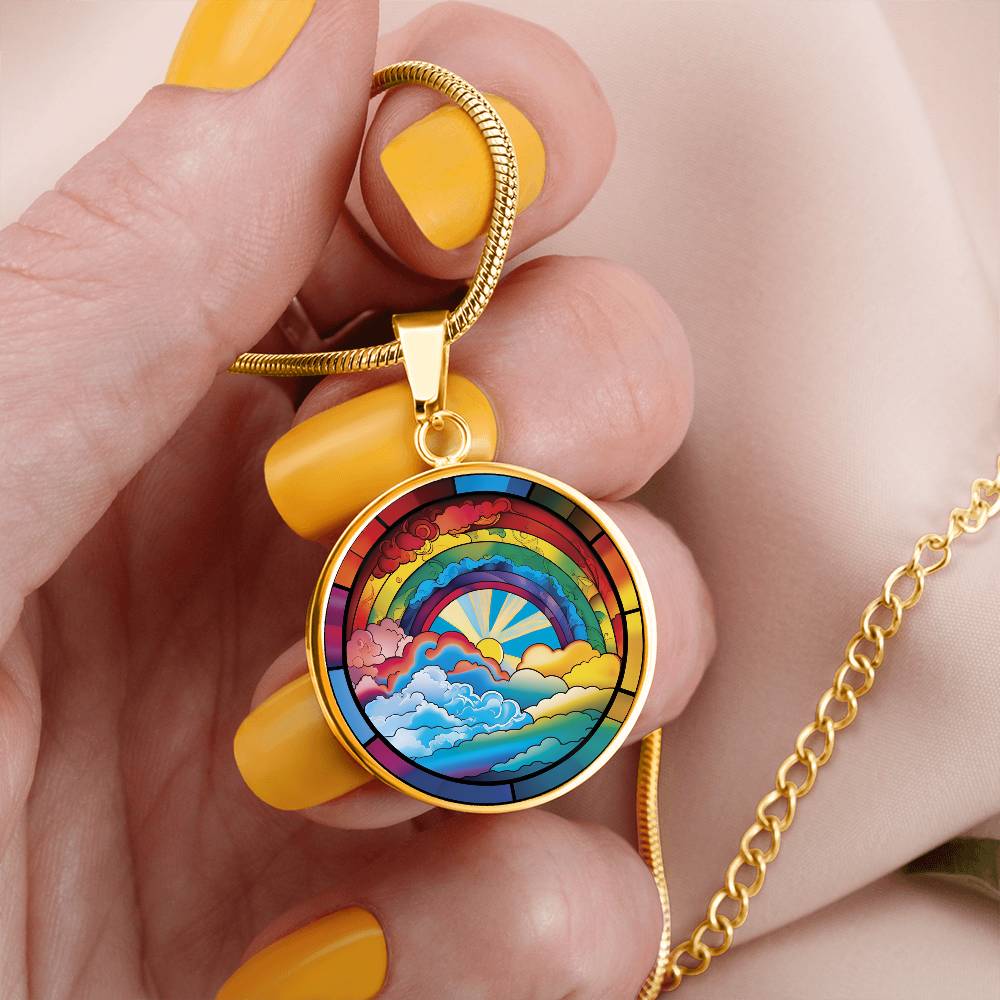 Woman holding an elegant gold pendant Lucky Rainbow Necklace. The colors are all the colors of the rainbow. This jewelry offers personalization with an engraving option for a name.