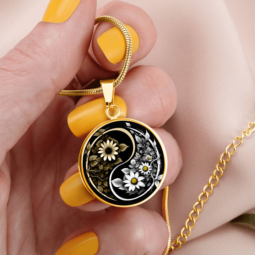 Woman holding a Gold Daisy Yin Yang Necklace