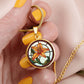 Woman holding an Elegant Gold pendant necklaces features an Orange Tiger Lily, Green Grass, white background with a red and brown frame. This necklace offers personalization with an engraving option for a name.