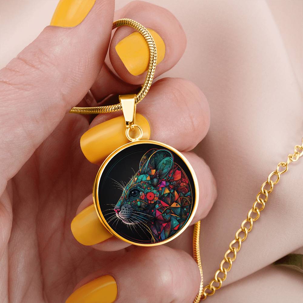 Woman holding an elegant gold pendant multicolored Chinese Zodiac Rat Necklace. This jewelry offers personalization with an engraving option for a name.