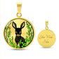 An Elegant gold pendant Deer Necklace. All in gold and black with green leaves. This jewelry offers personalization with an engraving option for a name.