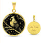 An Elegant gold pendant featuring a vivid gold Northern Cardinal Necklace with Stars and a tree Branch all in a gold and black backdrop. This jewelry offers personalization with an engraving option for a name.