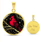 An Elegant gold pendant featuring a vivid Red Northern Cardinal Necklace with Stars and a tree Branch all in a gold and black backdrop. This jewelry offers personalization with an engraving option for a name.
