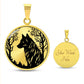an Elegant gold pendant wolf necklace featuring a vivid Black Wolf in the forest, set against a Gold backdrop. This jewelry offers personalization with an engraving option for a name.
