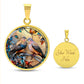 Elegant gold pendant necklace featuring two turtle doves, set against a subtle tan backdrop. This jewelry offers personalization with an engraving option for a name.
