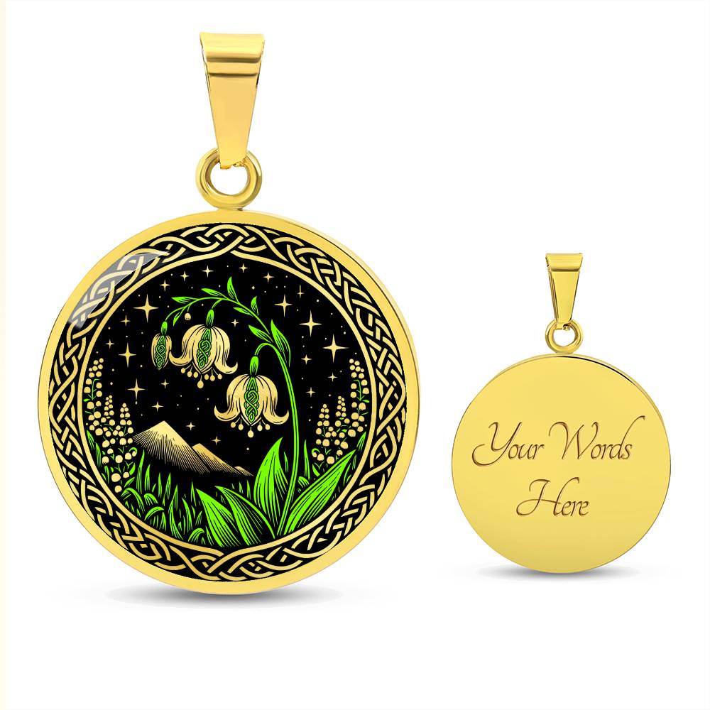 An Elegant gold pendant Celtic Lily Of The Valley Necklace featuring Green Grass, gold Mountains, Stars,  Lily Of The Valleys, Celtic Knot Frame with a black backdrop. This jewelry offers personalized engraving option for a name.