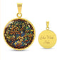 An elegant gold pendant Hawthorn Necklace. Colors yellow Flowers, Green Leaves, Brown branches, Blue Background, Orange Berries. This jewelry offers personalization with an engraving option for a name.
