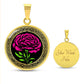 an Elegant January gold pendant Celtic Carnation Birth Flower necklace featuring a vivid pink, green flower, set against a gold & black backdrop. This jewelry offers personalization with an engraving option for a name.