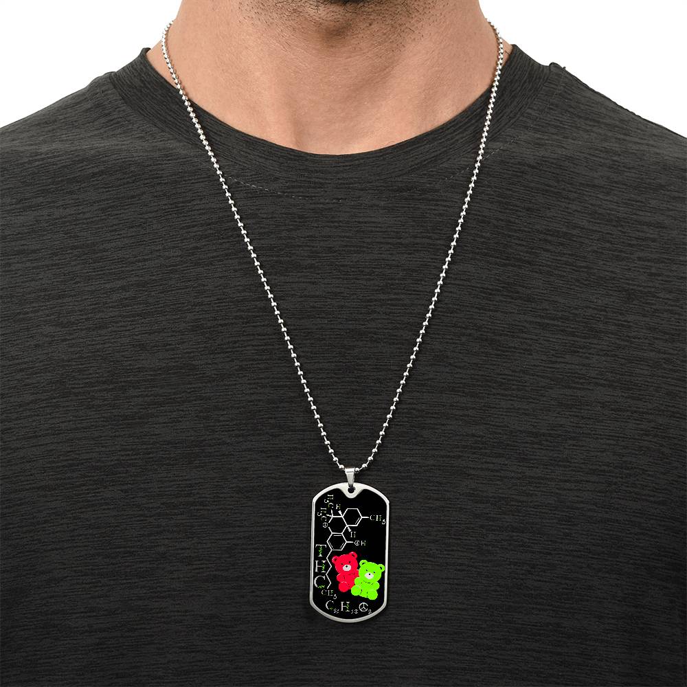 Man wearing an elegant silver pendant periodic table THC Bear Necklace. Colors are silver, black, Green and Red. This jewelry offers personalization with an engraving option for a name.