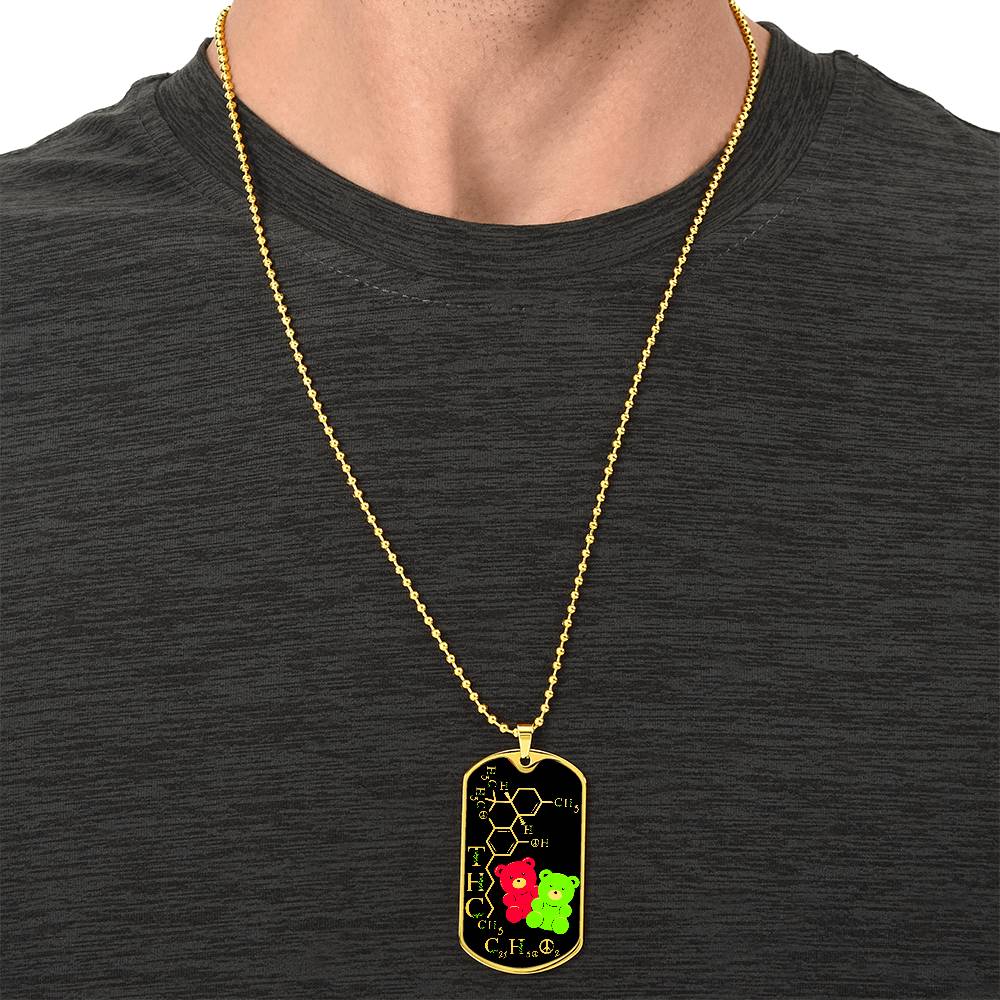 Man wearing an elegant gold pendant periodic table THC Bear Necklace. Colors are real gold, black, Green and Red. This jewelry offers personalization with an engraving option for a name.