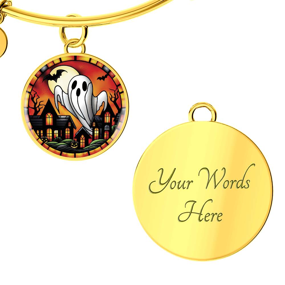 An elegant gold pendant Halloween Ghost Bracelet. The colors are white, black, yellow, orange and green. This jewelry offers personalization with an engraving option for a name.