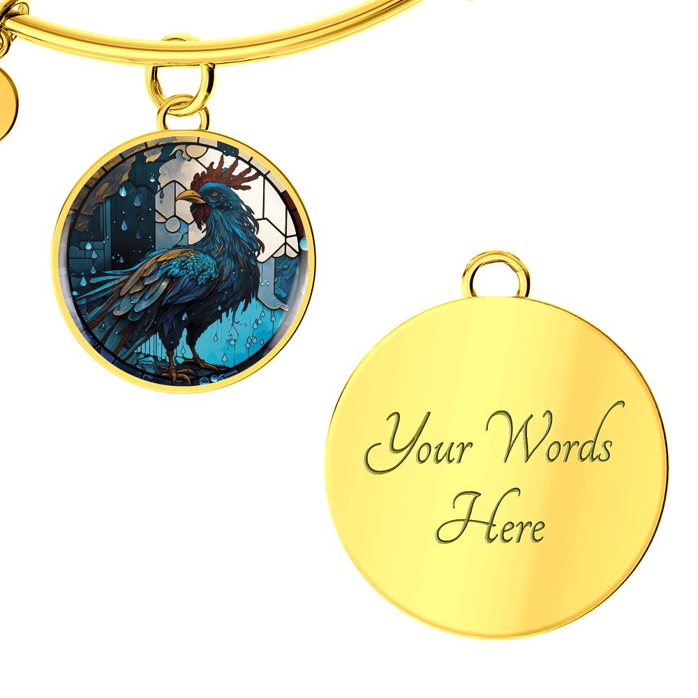 an Elegant gold pendant Rooster Bracelet, featuring a blue/red colored rooster set against a tan/blue Rain backdrop. This jewelry offers personalization with an engraving option for a name.