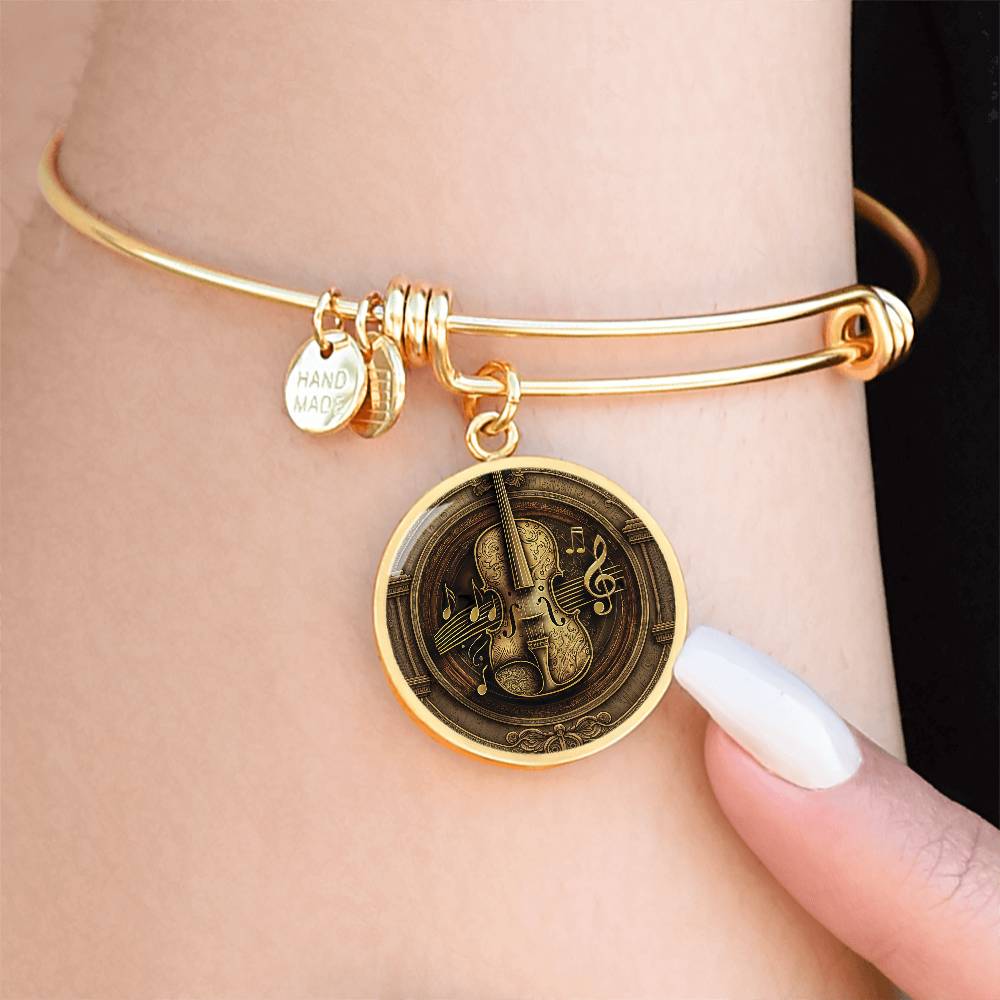 Woman wearing an elegant gold pendant Violet Bracelet. The colors are brown, black and tan. This jewelry offers personalization with an engraving option for a name.