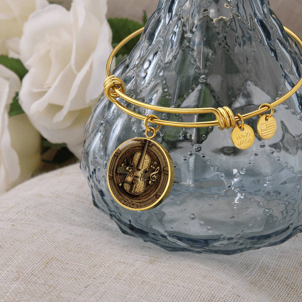 An elegant gold pendant Violet Bracelet. The colors are brown, black and tan. This jewelry offers personalization with an engraving option for a name.