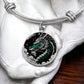 an Elegant silver pendant with a Jade Dragon Bracelet set against a silver and black backdrop. This jewelry offers personalization with an engraving option for a name.