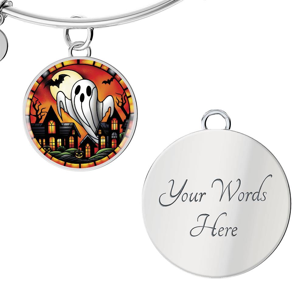 An elegant silver pendant Halloween Ghost Bracelet. The colors are white, black, yellow, orange and green. This jewelry offers personalization with an engraving option for a name.