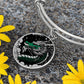 an Elegant silver pendant with a Jade Dragon Bracelet set against a silver and black backdrop. This jewelry offers personalization with an engraving option for a name.