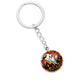 An elegant silver pendant Halloween Ghost Keychain. The colors are white, black, yellow, orange and green. This jewelry offers personalization with an engraving option for a name.