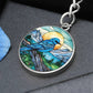An elegant silver pendant Bluebird Necklace. The colors are blue, green,  brown and yellow. This jewelry offers personalization with an engraving option for a name.