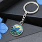 An elegant silver pendant Bluebird Necklace. The colors are blue, green,  brown and yellow. This jewelry offers personalization with an engraving option for a name.
