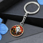 An elegant silver pendant Halloween Ghost Keychain. The colors are white, black, yellow, orange and green. This jewelry offers personalization with an engraving option for a name.