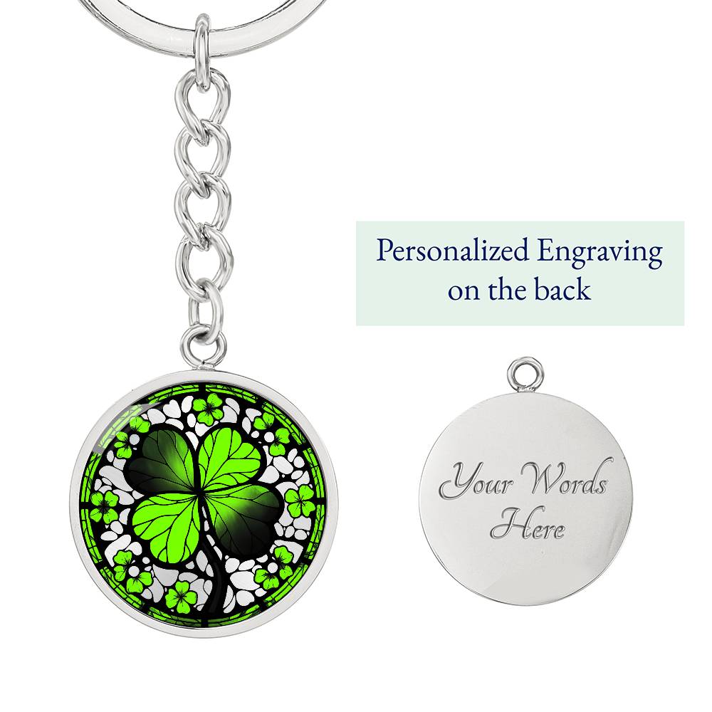 Elegant Silver pendant featuring a vivid Four Leaf Clover Keychain, set against a silver backdrop. This jewelry offers personalization with an engraving option for a name