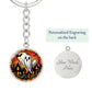 An elegant silver pendant Halloween Ghost Keychain. The colors are white, black, yellow, orange and green. This jewelry offers personalization with an engraving option for a name.