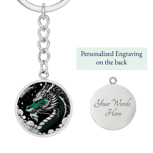 an Elegant silver pendant featuring a vivid Jade Dragon keychain set against a silver and black backdrop. This jewelry offers personalization with an engraving option for a name.