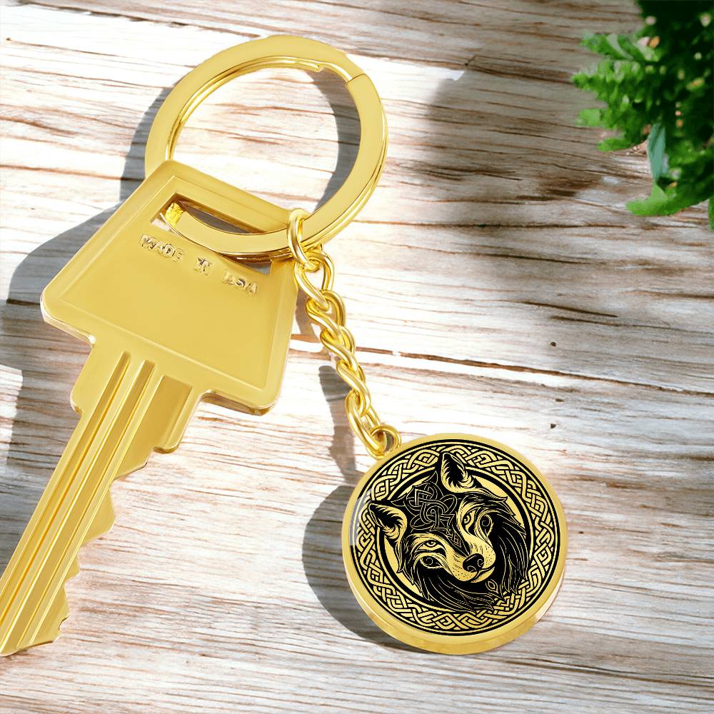 An Elegant Gold pendant Celtic Wolf Keychain with a Gold and Black background. This jewelry offers personalization with an engraving option for a name.