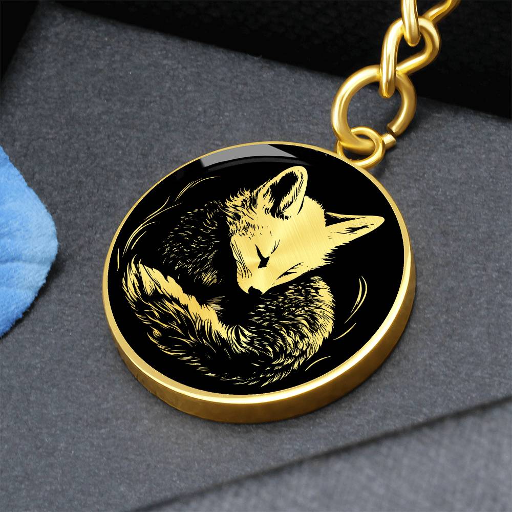 an Elegant Gold pendant featuring a Personalized Fox Keychain, With a gold Fox Set against a black background. This jewelry offers Customization with an engraving option for a name.