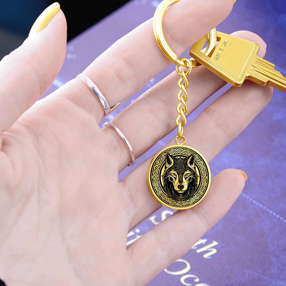 Woman holding An Elegant Gold pendant Celtic Wolf Keychain with a Gold and Black background. This jewelry offers personalization with an engraving option for a name.