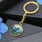An elegant gold pendant Bluebird Necklace. The colors are blue, green,  brown and yellow. This jewelry offers personalization with an engraving option for a name.