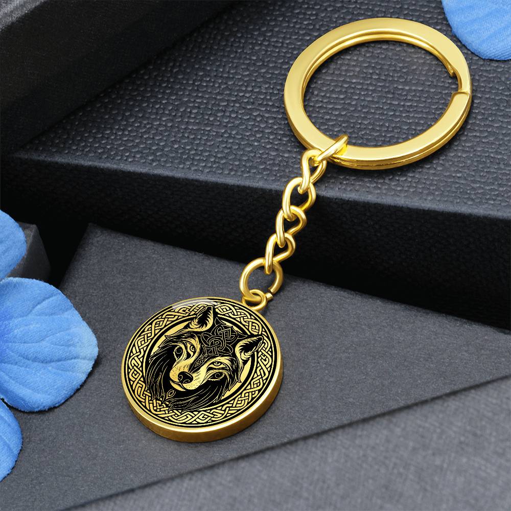 An Elegant Gold pendant Celtic Wolf Keychain with a Gold and Black background. This jewelry offers personalization with an engraving option for a name.