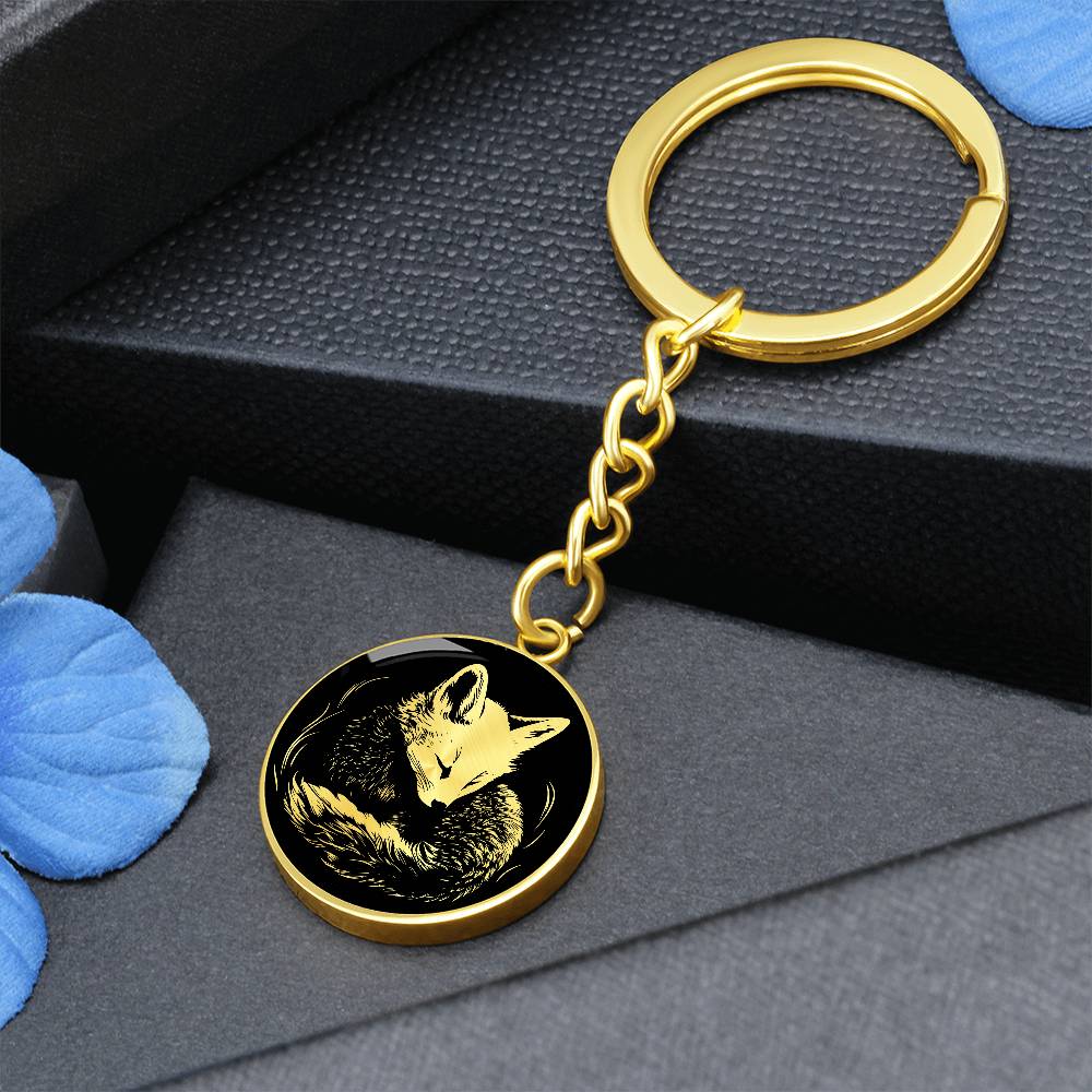 an Elegant Gold pendant featuring a Personalized Fox Keychain, With a gold Fox Set against a black background. This jewelry offers Customization with an engraving option for a name.