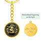 This Year of the dragon keychain. Elegant gold pendant with a rabbit & dragon, is set against a gold backdrop. This jewelry offers personalization with an engraving option for a name.