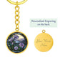 An elegant gold pendant Morning Glory Keychain, The Colors are green, purple, blue and tan. This jewelry offers personalization with an engraving option for a name.